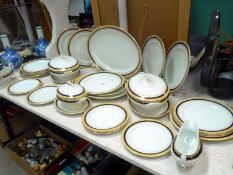 An early to mid 20th C dinner set of over 30 pieces including tureens