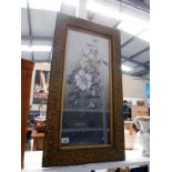 A large gilt framed and glazed oil on board of flowers