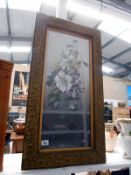 A large gilt framed and glazed oil on board of flowers