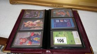 Album of telephone cards inc. golden wonder, the Muppets, Manchester united etc.