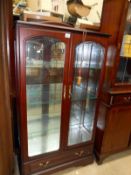 A good quality display cabinet with glass shelves