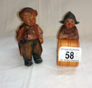 A pair of carved German children napkin rings