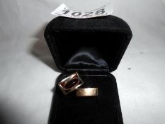 A pair of unusual wedding and engagement rings custom made with 9ct gold set with garnets approx.