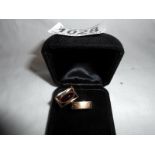 A pair of unusual wedding and engagement rings custom made with 9ct gold set with garnets approx.