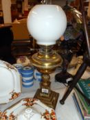 Oil table lamp with brass base chimney and globe