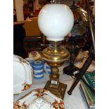 Oil table lamp with brass base chimney and globe