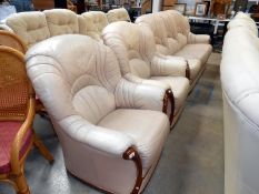 A 3 piece cream faux-leather suite consisting of 3 seater sofa & 2 armchairs