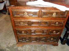 An 18th century carved oak chest