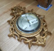 A gilt framed barometer