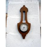 Small mahogany inlaid barometer