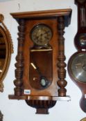 A wall clock with key and pendulum