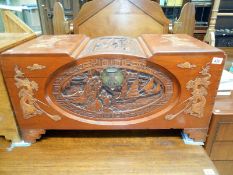 A heavily carved early 20th C camphor wood trunk
