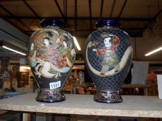 A pair of early 20th century Satsuma vases signed
