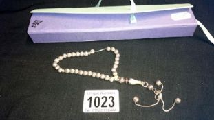 A set of silver prayer beads