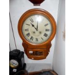 A school clock with key and pendulum