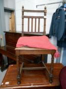 An oak hall chair with fluted legs & rail back