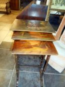 A nest of 3 tables with hand painted tops signed Rene
