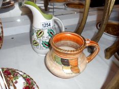 Charlotte Rhead floral jug and a Crown Ducal jug