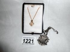 9ct gold pendant set with pearl and a silver fob with silver chian