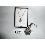 9ct gold pendant set with pearl and a silver fob with silver chian