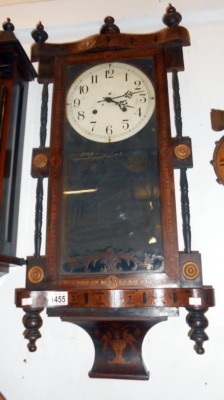 A Victorian inalid wall clock with key and pendulum
