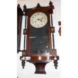 A Victorian inalid wall clock with key and pendulum