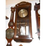 A wall clock with key and pendulum