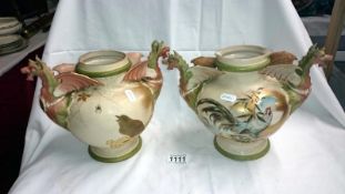A pair of interesting hand painted Continental vases with dragon handles & paintings of birds