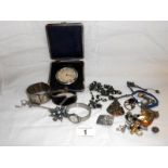 Quantity of costume jewellery and a travelling clock