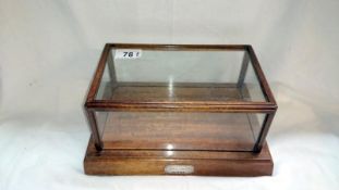 Mahogany display case with silver plaque to front