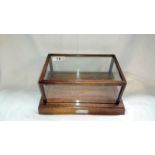 Mahogany display case with silver plaque to front