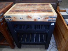 A butchers block on painted stand with wine rack