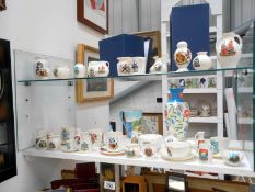 40 items of crested china from various makers including cups and saucers, loving cups,