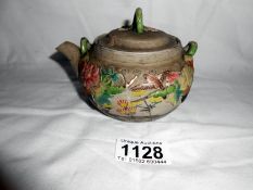Oriental tea pot with separate strainer