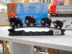 An ebony bridge of elephants