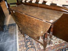 An oak drop leaf table