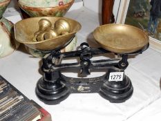 Set of kitchen scales with brass pans and set of brass bell weights