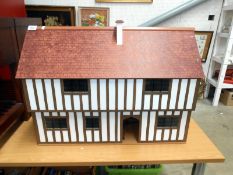 A model Tudor house with accessories