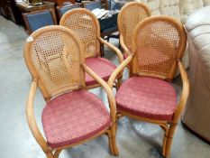 A set of 4 wicker carver chairs