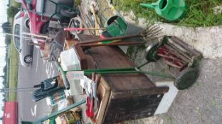 A cabinet, quantity of garden tools & mower etc.