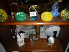 A collection of paperweights etc.