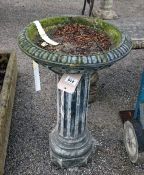 A stone bird bath