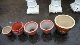 A quantity of terracotta plant pots
