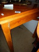 A good quality oak dining table with swivel & fold top