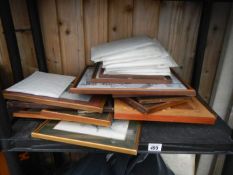 A shelf of picture frames & prints etc.