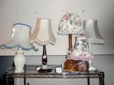 A shelf of electric table lamps