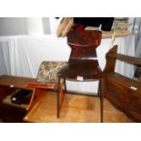 An old foot stool and retro kitchen chair
