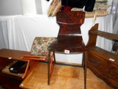 An old foot stool and retro kitchen chair