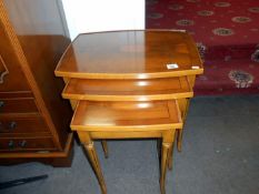 A superb yew wood nest of 3 tables ( Harris & Baker)