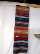 A hand woven wall hanging